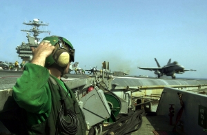 U.S. Navy jet launching from aircraft carrier